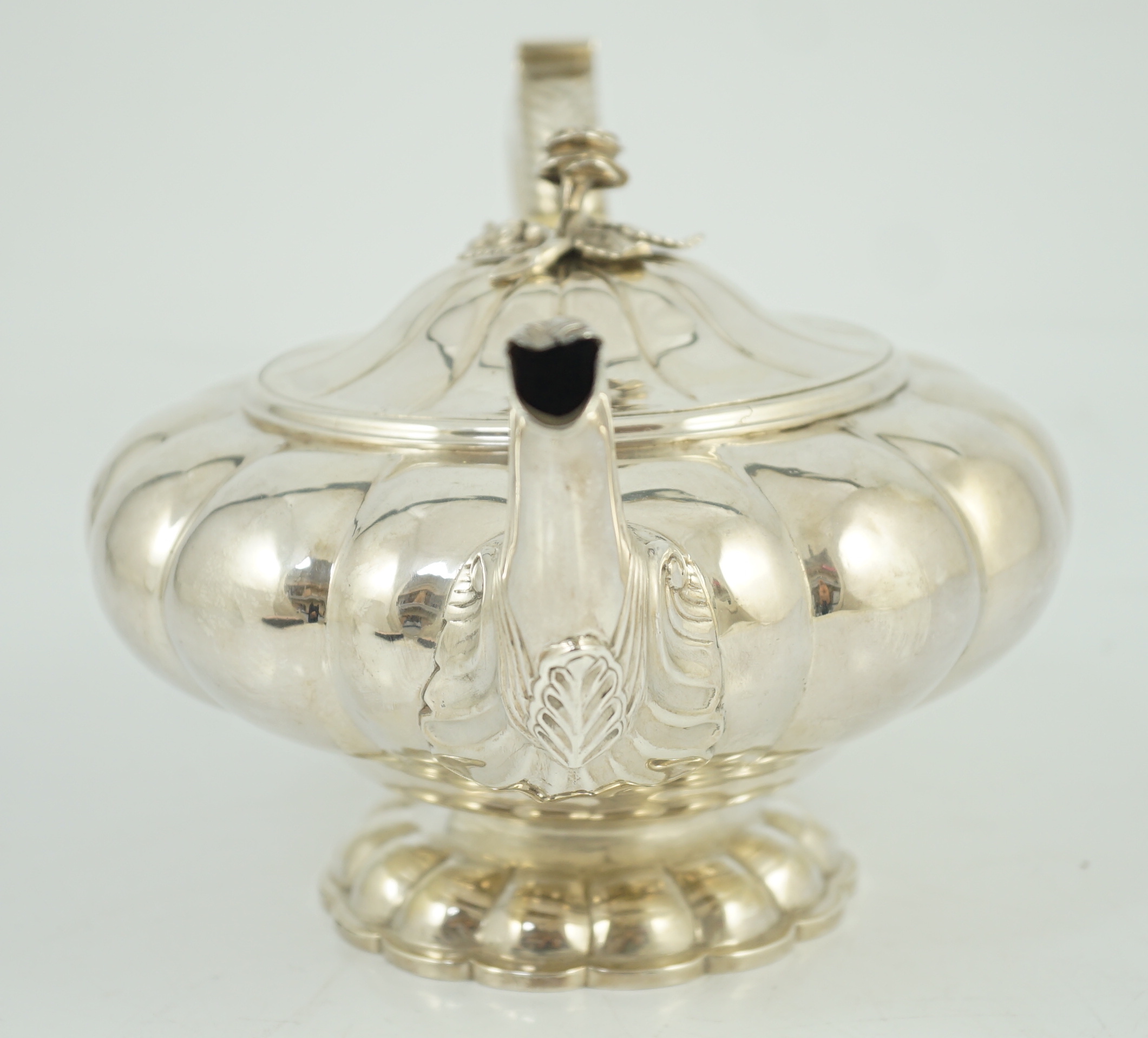 A George IV silver melon shaped pedestal teapot, by Joseph Angell I